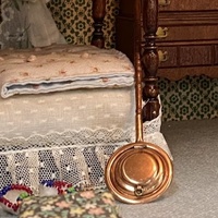 A Photograph of the Brass Foot-Warmer in Mrs. Fisher&#039;s Dollhouse, Colonial Bedroom, [ca. 1950s-1960s]